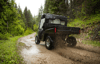 Off-road vehicle driving over rugged terrain with lightweight structural components made from high-performance polyamide.