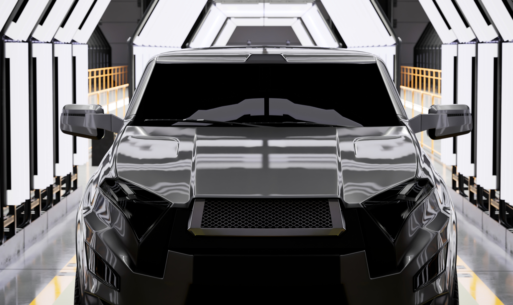 Front of a new vehicle on an automotive production line, representing Thermylene™ PP-GF40% front-end module applications.