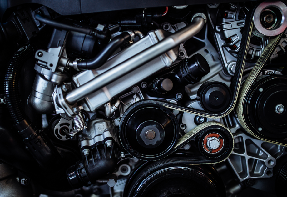 Reinforced nylon automotive bracket replacing a die-cast metal component for lightweighting.