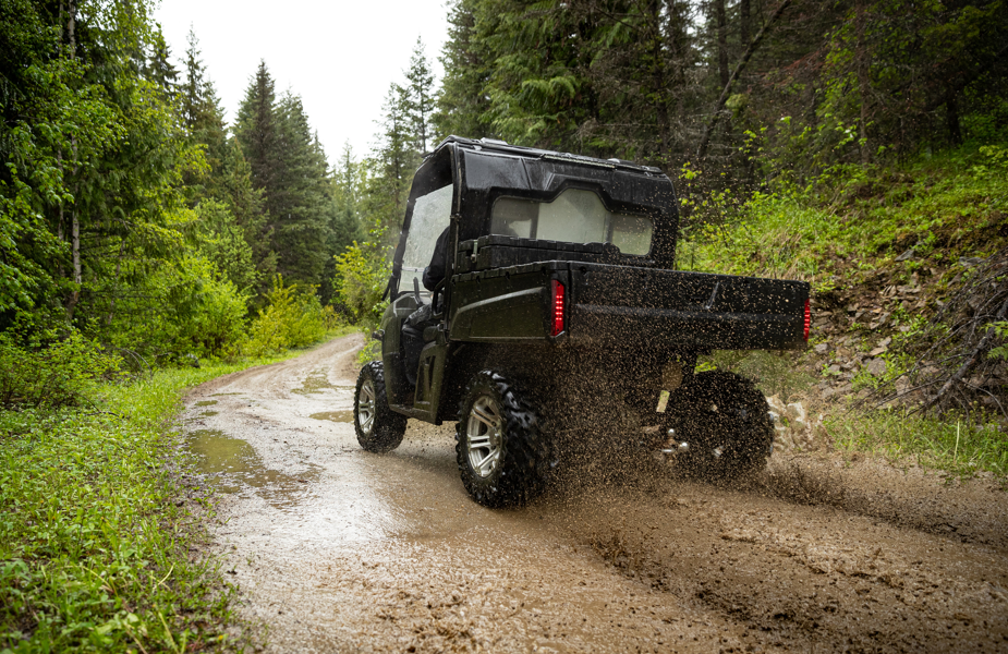 Off-road vehicle driving over rugged terrain with lightweight structural components made from high-performance polyamide.
